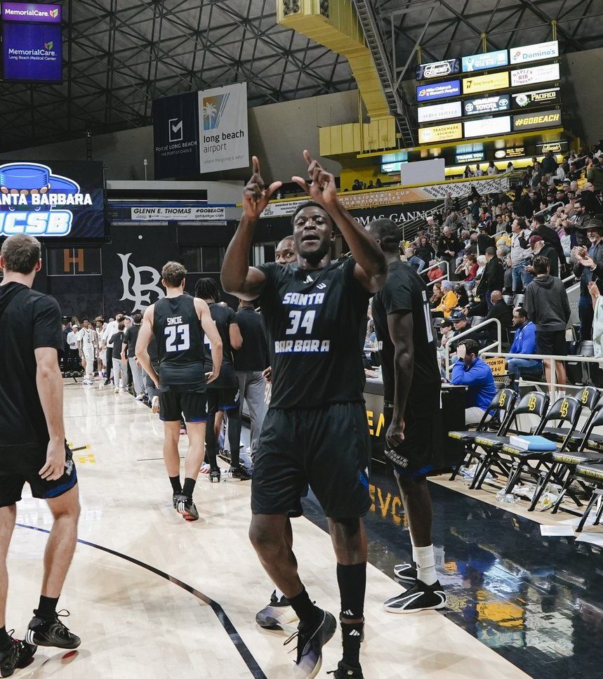 Hosana pointing to the crowd in a Santa Barbara #34 jersey